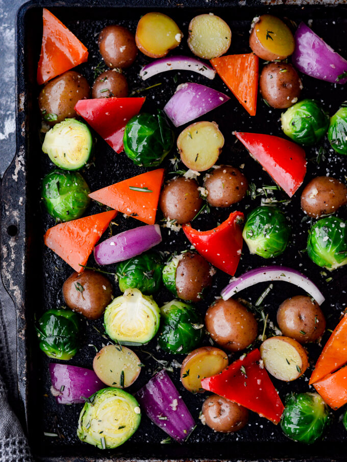 Raw Veggies with Garlic and Herbs on a cookie sheet.