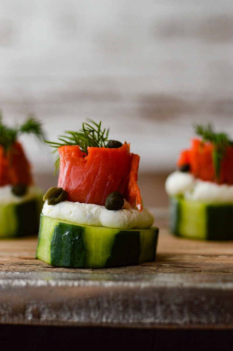 Smoked Salmon and Cream Cheese Timbales with Cucumbers on a wooden tray